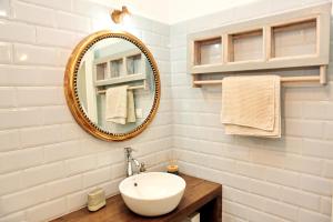 a bathroom with a sink and a mirror at Rodia House in Glossa