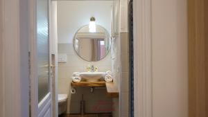 a bathroom with a sink and a mirror at Dimora Elizabeth II in Modugno