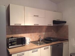 Kuchyň nebo kuchyňský kout v ubytování Apartments Bartulić