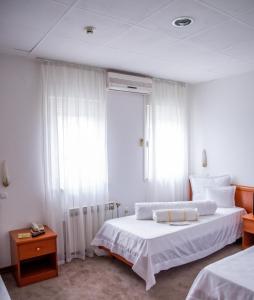Postel nebo postele na pokoji v ubytování Hotel Integra