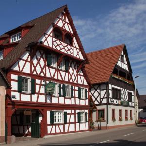 a building with red and white at Hotel Engel in Rheinmunster