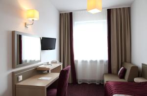 TV a/nebo společenská místnost v ubytování Arche Hotel Siedlce