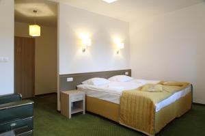 Postel nebo postele na pokoji v ubytování Arche Hotel Siedlce