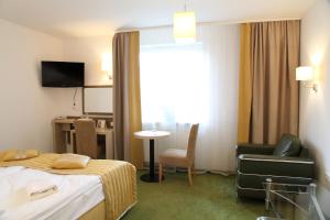 TV a/nebo společenská místnost v ubytování Arche Hotel Siedlce