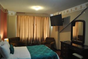 Postel nebo postele na pokoji v ubytování Hotel Makroz