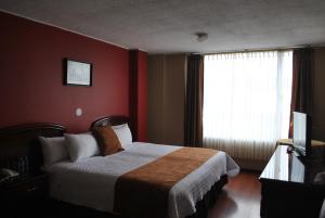 Postel nebo postele na pokoji v ubytování Hotel Makroz