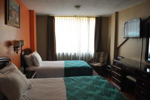 Postel nebo postele na pokoji v ubytování Hotel Makroz