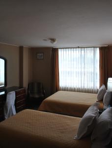 Postel nebo postele na pokoji v ubytování Hotel Makroz