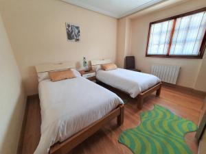 Posteľ alebo postele v izbe v ubytovaní Casa familiar con jardín “Arana Etxea” EBI01207