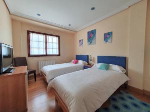 Posteľ alebo postele v izbe v ubytovaní Casa familiar con jardín “Arana Etxea” EBI01207