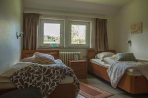 Un pat sau paturi într-o cameră la Welt Lodge
