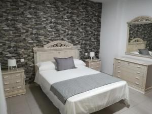 Cama o camas de una habitación en Vivienda compartida Tajaraste
