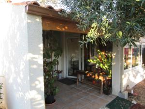 a front porch of a house with plants at MARANATHA in Les Gonds