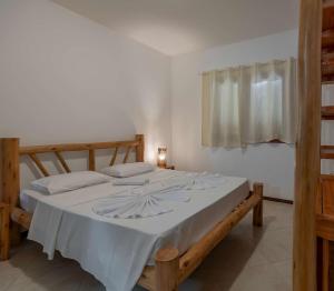 Cama ou camas em um quarto em Village Muta