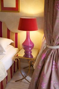 Säng eller sängar i ett rum på Hotel Apia