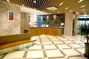 a lobby with a waiting area in a building at Hotel Laon in Busan