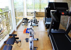 a gym with two exercise bikes in a room at Sapphire Sky Hotel & Conference in Serpong