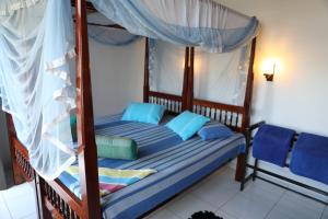 Voodi või voodid majutusasutuse Main Reef Guest House toas