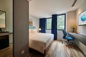Postel nebo postele na pokoji v ubytování J-Hotel by Dorsett
