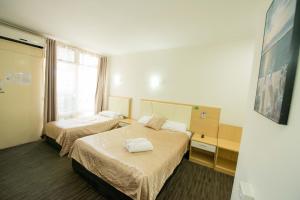 Postel nebo postele na pokoji v ubytování Jacksons Motor Inn