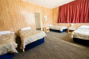Postel nebo postele na pokoji v ubytování Jacksons Motor Inn