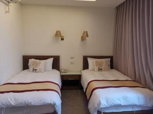 Postel nebo postele na pokoji v ubytování Mu Xi Ocean View B&B