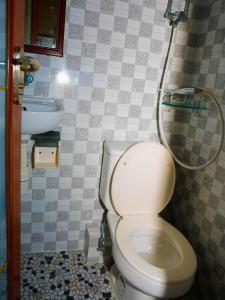 a bathroom with a toilet and a sink at Everest Hostel in Hong Kong