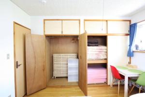 Postel nebo postele na pokoji v ubytování 湘南かたせ家