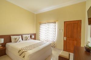 Voodi või voodid majutusasutuse Diana Hotel Jogja toas