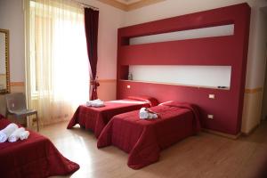 Postel nebo postele na pokoji v ubytování B&B The Queens