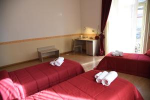 Postel nebo postele na pokoji v ubytování B&B The Queens