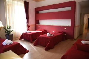 Postel nebo postele na pokoji v ubytování B&B The Queens
