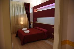 Postel nebo postele na pokoji v ubytování B&B The Queens