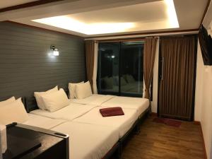 Postel nebo postele na pokoji v ubytování Sinsamut Koh Samed