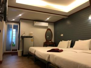 Postel nebo postele na pokoji v ubytování Sinsamut Koh Samed