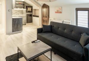 a living room with a couch and a table at The Red Roof House in Plovdiv