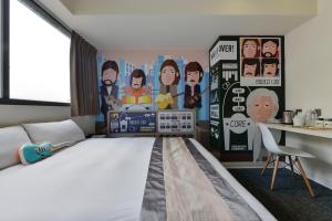 Postel nebo postele na pokoji v ubytování Taichung Box Design Hotels