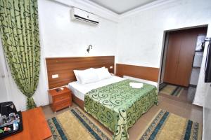 Postel nebo postele na pokoji v ubytování Hotel Chao