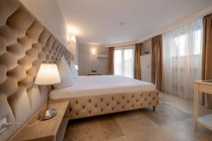 Postel nebo postele na pokoji v ubytování Hotel Casa Fiori