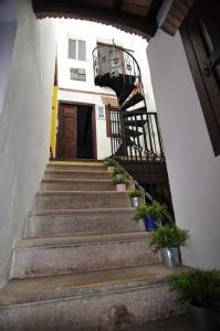 a staircase leading up to a building with a door at `PRECIOSA CASA ANDALUZA CON VISTAS in San Roque