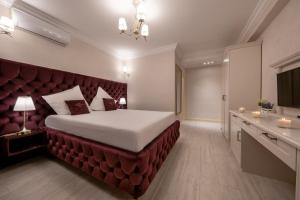 Postel nebo postele na pokoji v ubytování Hotel Casa Fiori