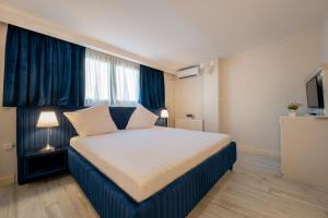 Postel nebo postele na pokoji v ubytování Hotel Casa Fiori