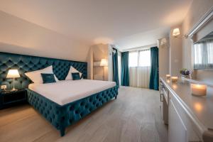 Postel nebo postele na pokoji v ubytování Hotel Casa Fiori