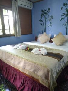 Ein Bett oder Betten in einem Zimmer der Unterkunft Lanta Valom Hideaway