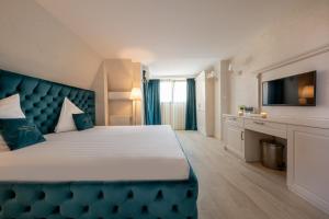 Postel nebo postele na pokoji v ubytování Hotel Casa Fiori