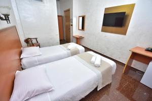 Postel nebo postele na pokoji v ubytování Hotel Chao