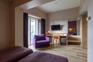Postel nebo postele na pokoji v ubytování Viiking Spa Hotel