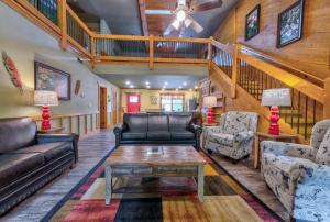 a living room with a couch and a table at A Breath of Fresh Air chalet in Gatlinburg