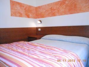 Postel nebo postele na pokoji v ubytování Albergo Villagrande