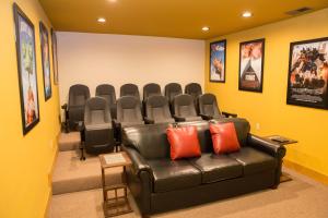 a waiting room with a leather couch and chairs at Serene Oasis chalet in Gatlinburg +63 photos